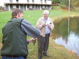 Caregiver and client fishing