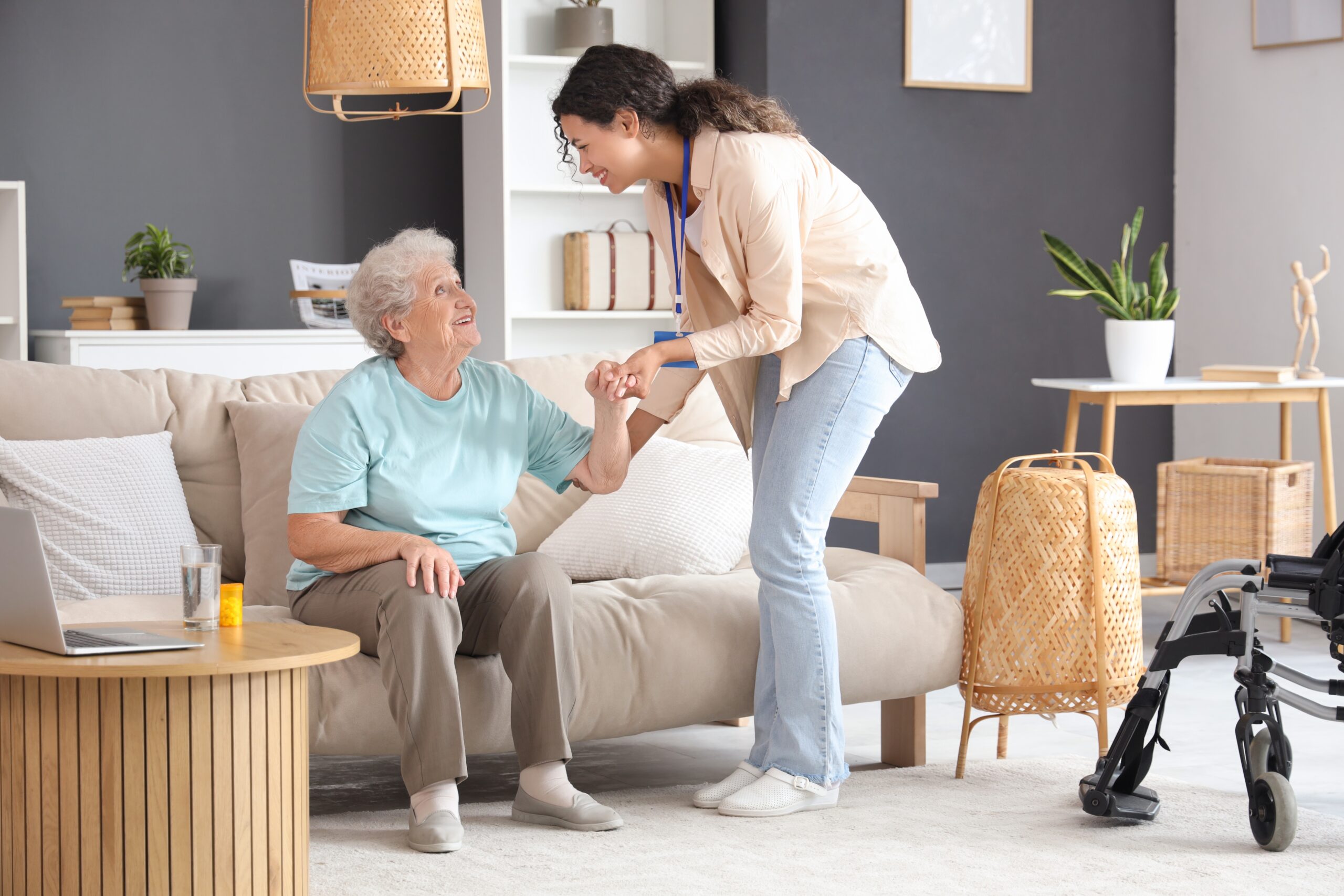 Young,African-american,Female,Medical,Worker,Helping,Elderly,Woman,In,Nursing